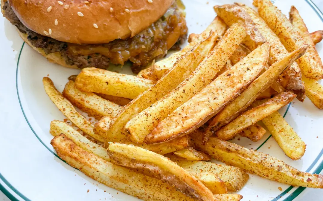 Smashed Cheeseburger with Caramalized Onions & Cajun Fries