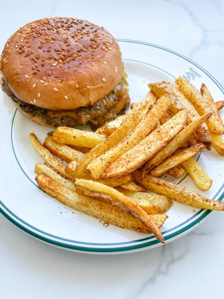 Smashed Cheeseburger with Caramalized Onions & Cajun Fries