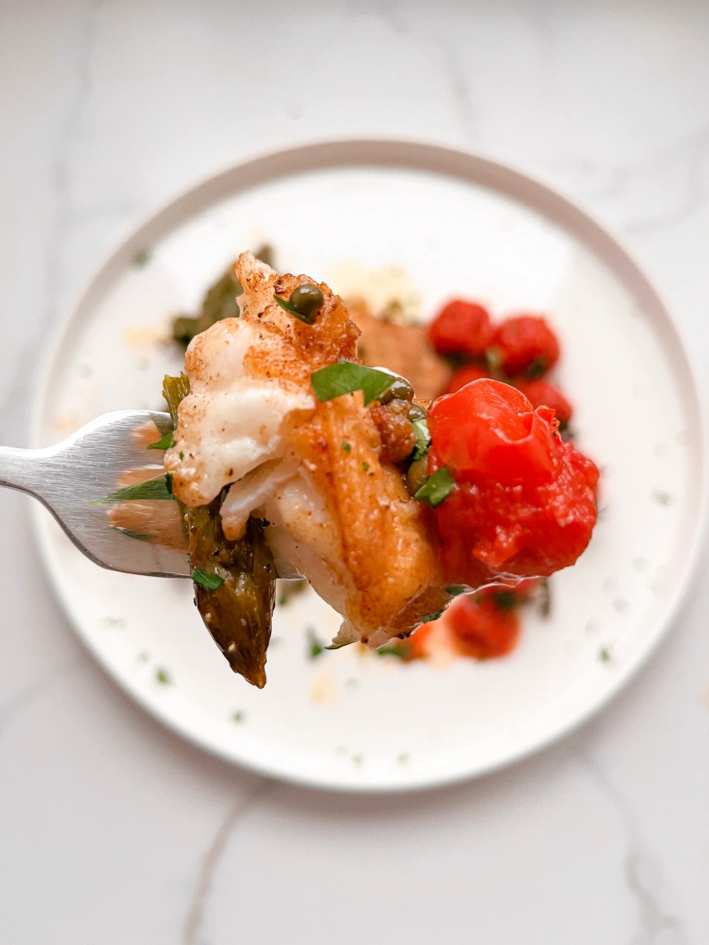 Cod with Caper Lemon Butter Baked Asparagus & Vine Tomatoes