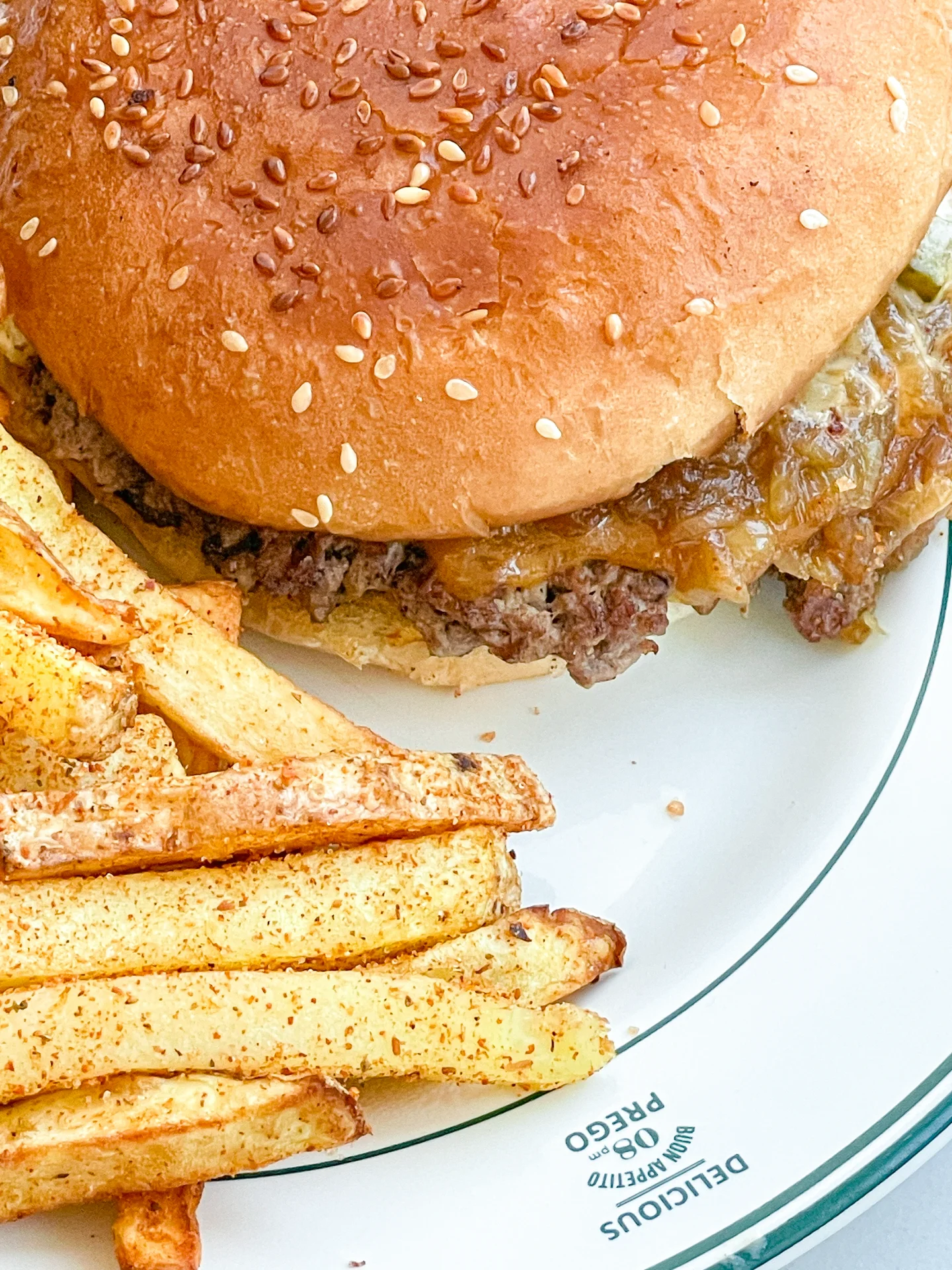 Smashed Cheeseburger with Caramalized Onions & Cajun Fries