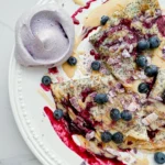 Poppyseed Crepe with Lemon Pastry Cream & Blueberry Meringue