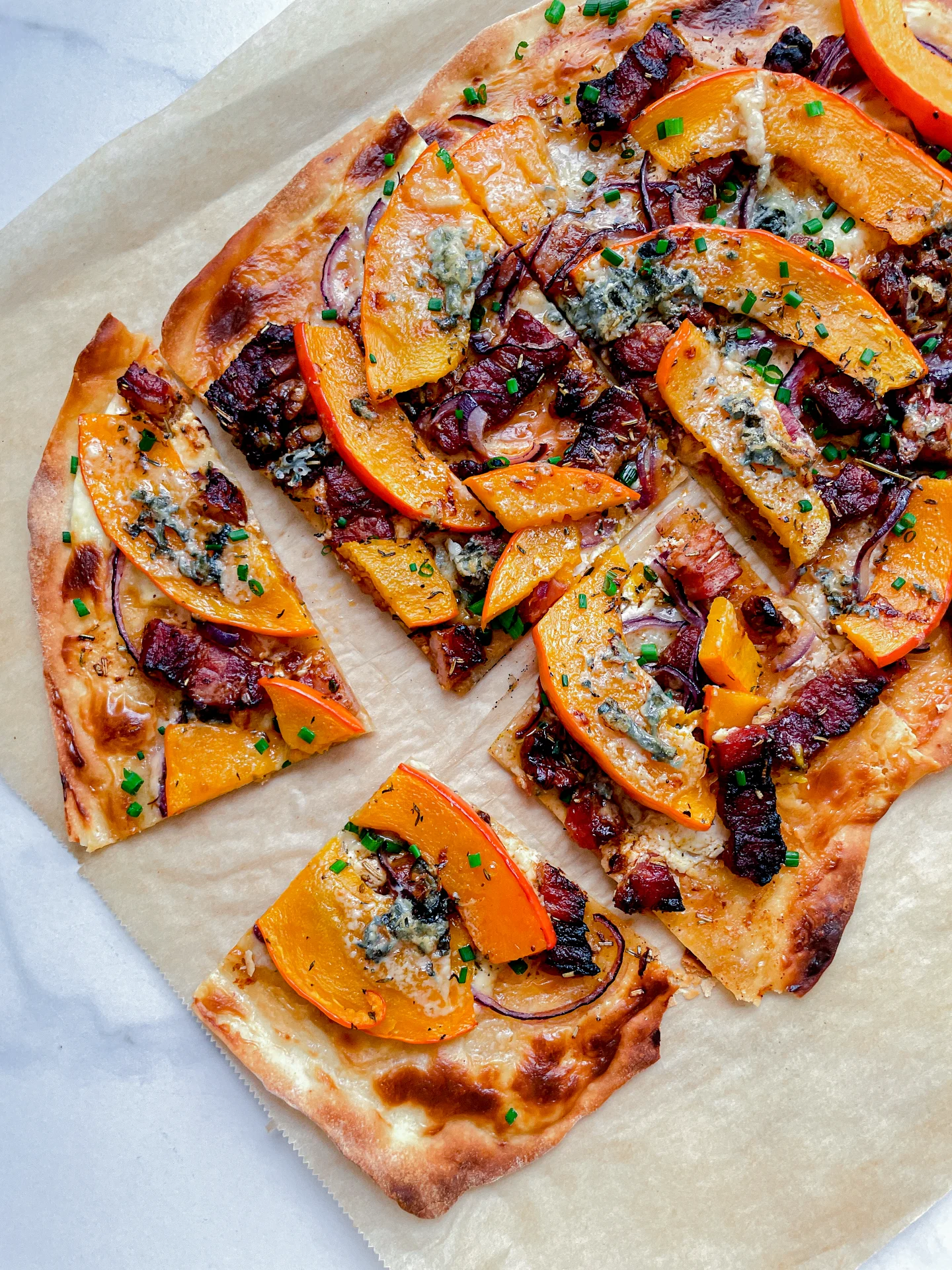 Pumpkin Tarte Flambée with Bacon Walnuts Gorgonzola & Lamb's Lettuce