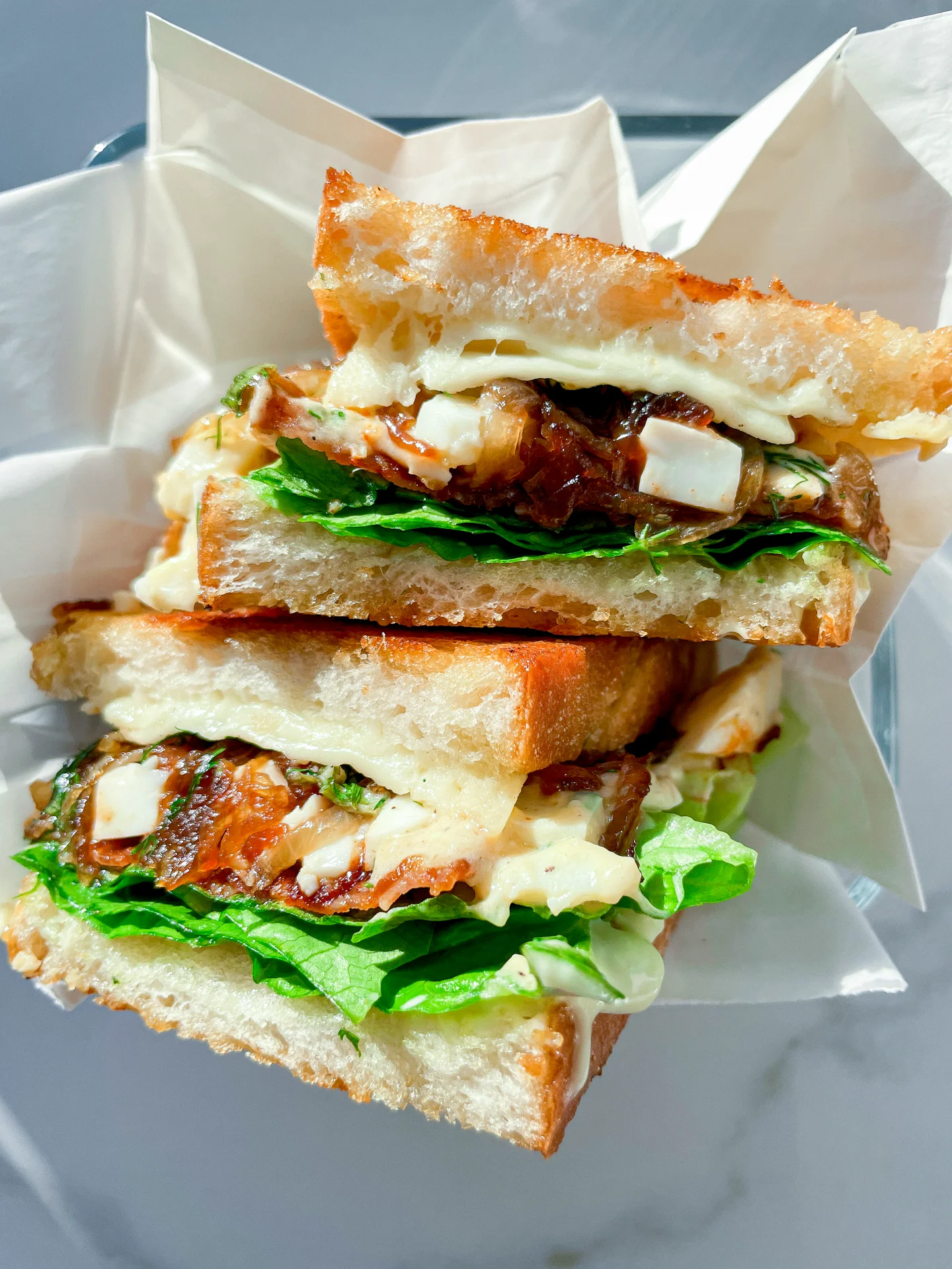 Crispy Sandwich with Egg Salad Spicy Bacon & Caramalized Onions