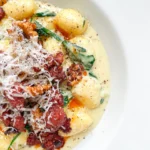 Gorgonzola Spinach Gnocchi with Salsiccia Walnut Topping