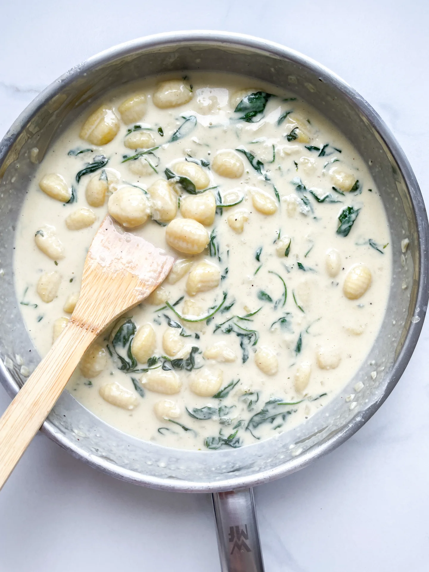 Gorgonzola Spinach Gnocchi with Salsiccia Walnut Topping