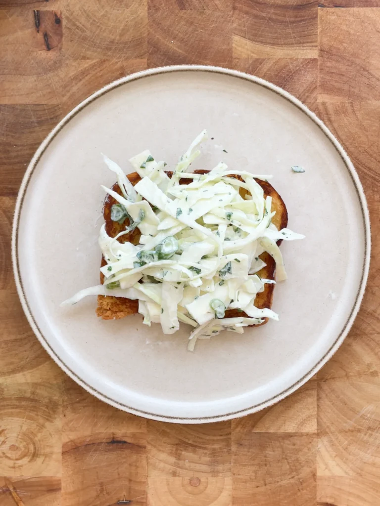 Crispy Sweet & Sour Chicken Brioche Sandwich with Yogurt Lime Slaw, ready to serve